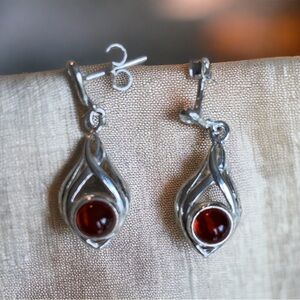 Deep red Baltic amber and sterling earrings. Delicate pattern.